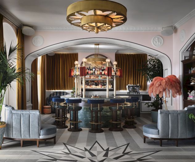 A cozy, stylish cafe with a warm wooden counter, hanging plants, arched ceiling, and comfortable seating for relaxed conversations.