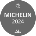 Michelin 2025 black badge with two white clover-like logos above the text “MICHELIN” and “2025.”