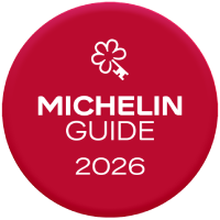 The image shows a Michelin Guide 2026 logo with a red circular badge and the Michelin flower emblem above the text 2026.